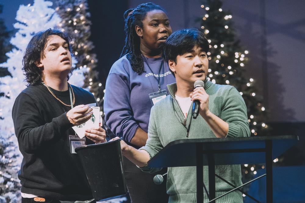 Speakers at the microphone during a WUMS gathering