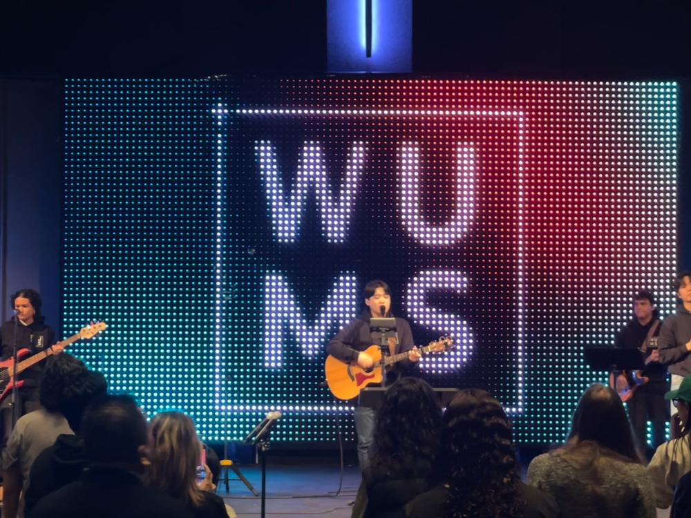 The band leading worship at a WUMS night