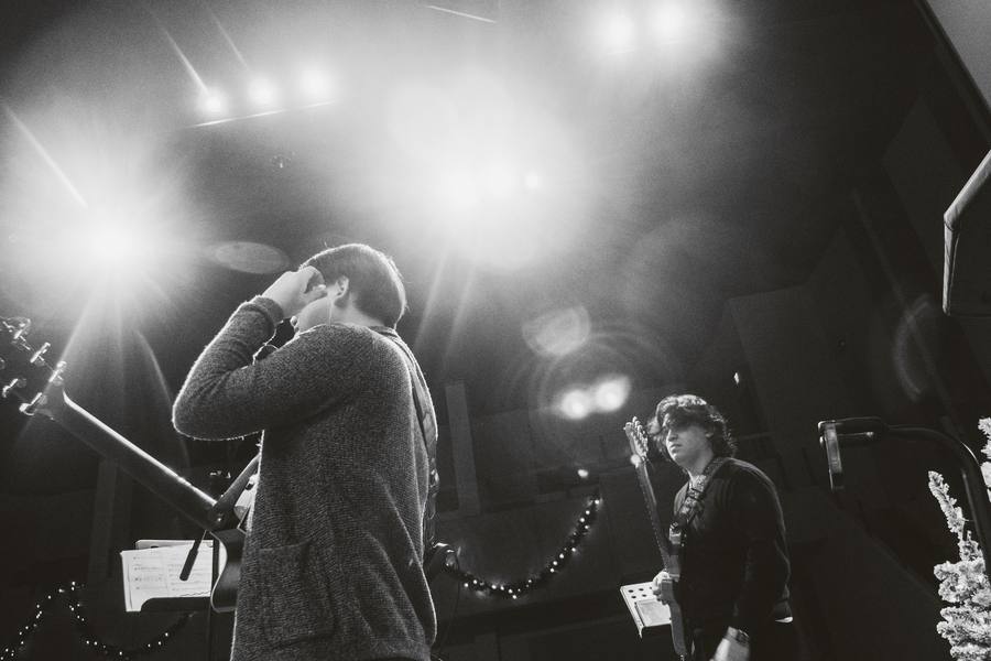 A moment of worship under the stage lights
