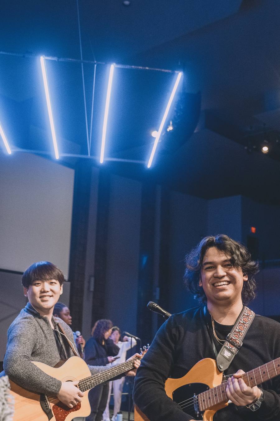 Guitarists leading from the stage