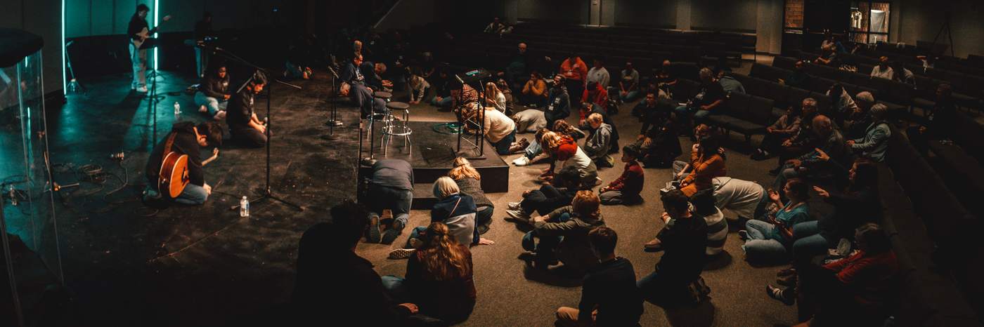 Young people praying together at a previous Wake Up My Soul night